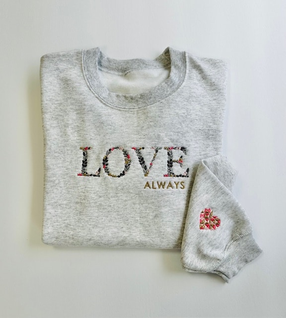 Ash gray jacket with "Love Always" text displayed prominently on the front, showcasing a stylish and modern design